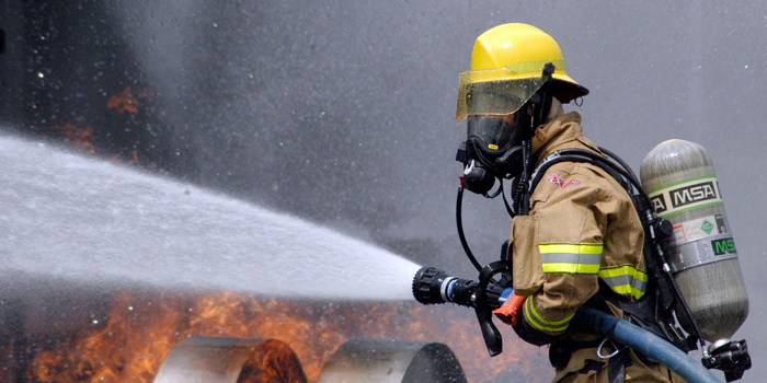 US_Navy_080730-N-5277R-003_A_Commander,_Naval_Forces_Japan_firefighter_douses_a_fire_on_a_dummy_aircraft_during_the_annual_off-station_mishap_drill_at_Naval_Support_Facility_Kamiseya